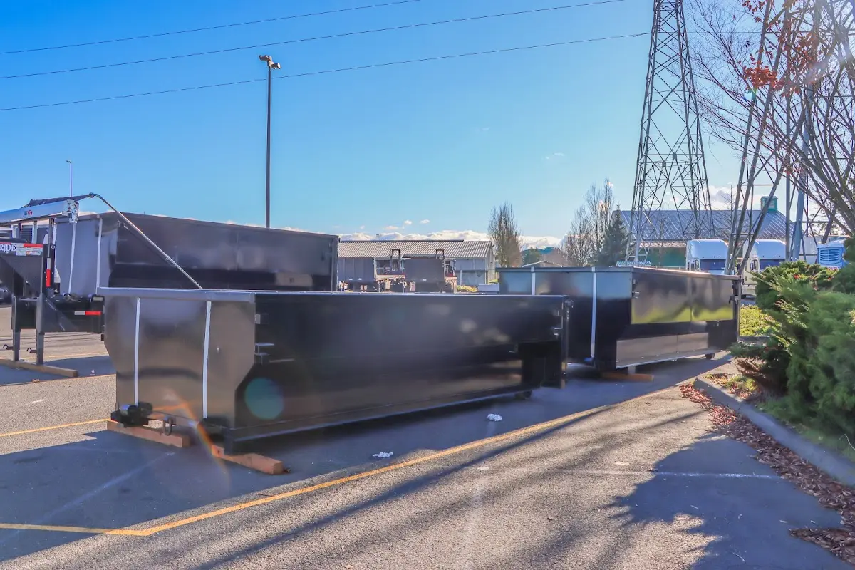 Roll-off dumpster ready for waste disposal at job site for 12 Yard Dumpster Rental in Bedford